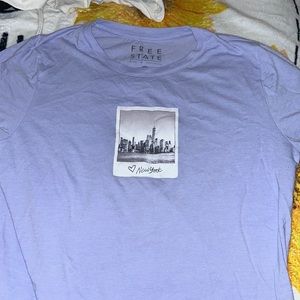 light purple new york tee XLA but fits like medium/large